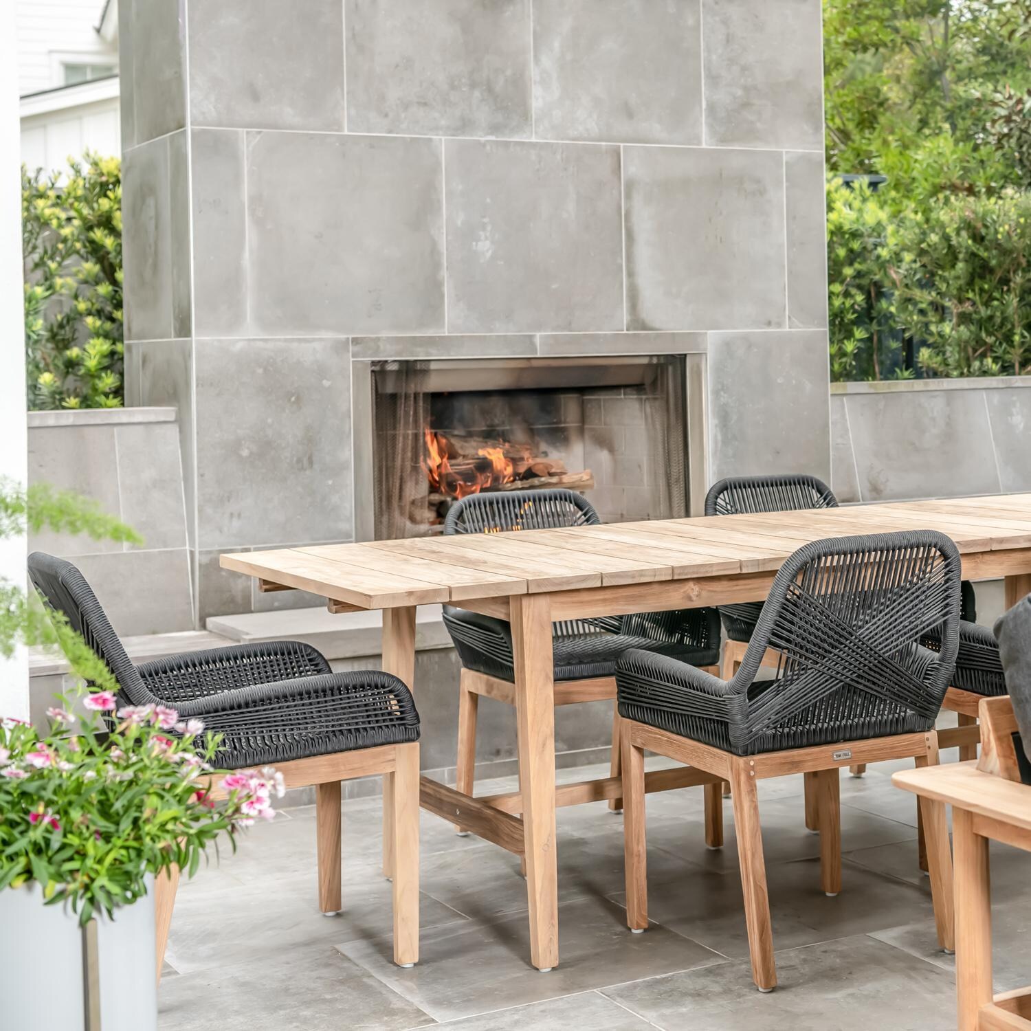 Teak + Table Breeze Olefin Rope & Teak Patio Dining Chair in Charcoal - Charcoal Lifestyle 1 - Lifestyle thumbnail