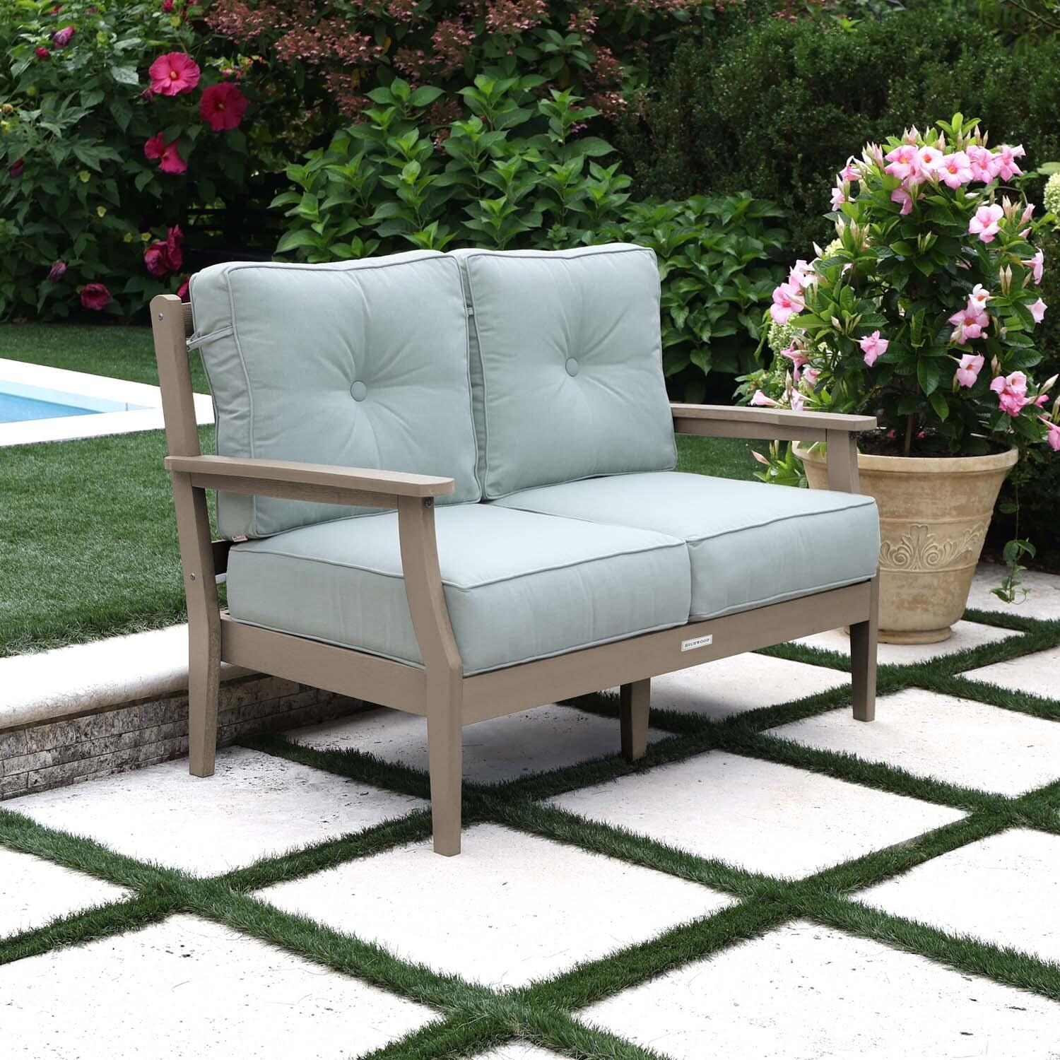Blushing Bay 2 Person Recycled Plastic Loveseat in Canvas Seasalt/Woodland Brown by Lakeview Outdoor Designs - Left Angled - Lifestyle thumbnail