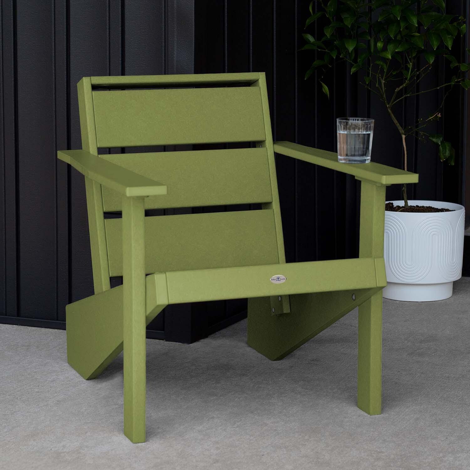 Hazel Cove Recycled Plastic Adirondack Chair in Palm Green by Lakeview Outdoor Designs - Next to Flowerpot - Lifestyle thumbnail