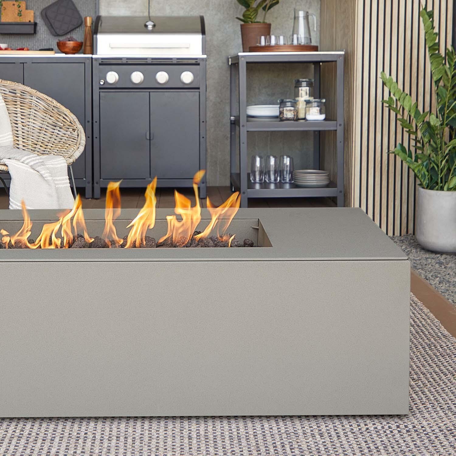 Covewood 58 Inch Rectangular Aluminum Propane Fire Pit Table w/ Hidden Propane Tank in Cloud Gray by BBQGuys Signature - Close Up - Lifestyle thumbnail