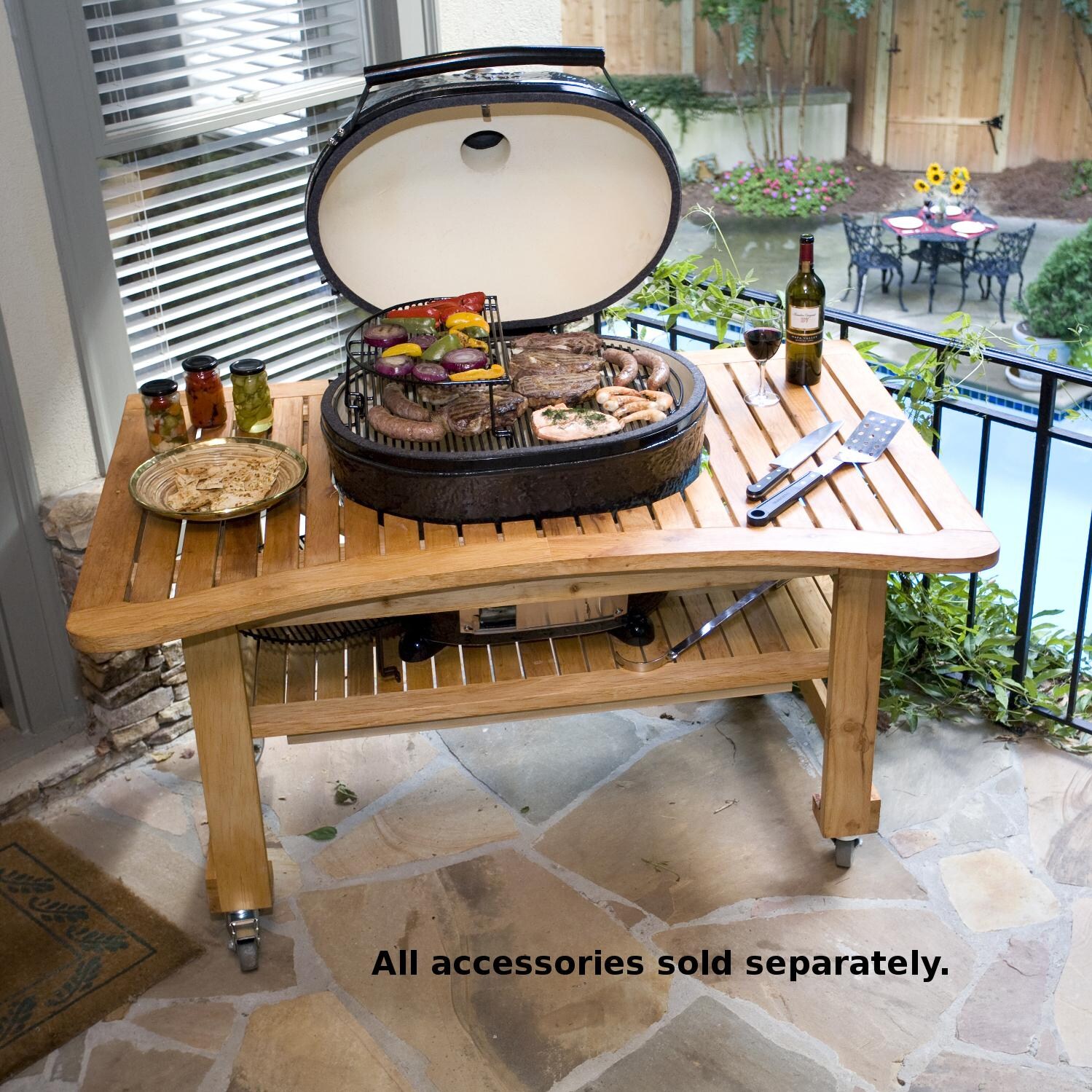 Primo Oval XL Ceramic Charcoal Smoker Grill On Teak Table - Lifestyle thumbnail