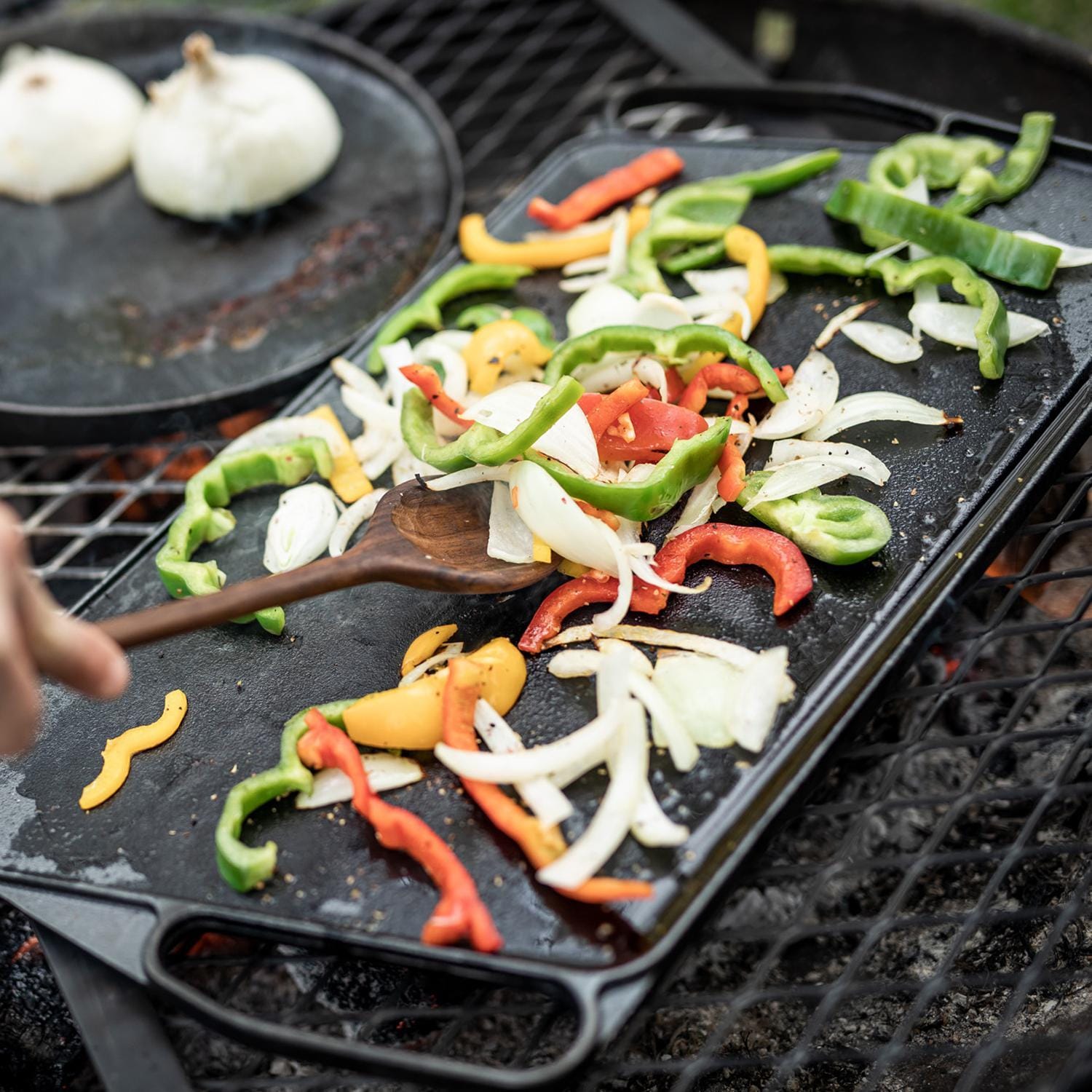 Barebones Living CKW-313 Reversible Cast Iron Griddle - Using Griddle Side - Lifestyle thumbnail