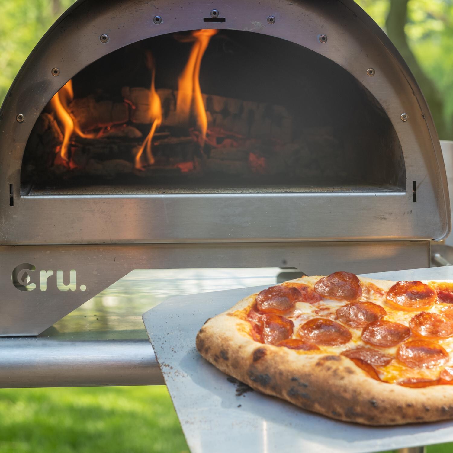 Cru Ovens Cru30 Model 30 Portable Outdoor Wood-Fired Pizza Oven - In Use With Pizza Peel thumbnail