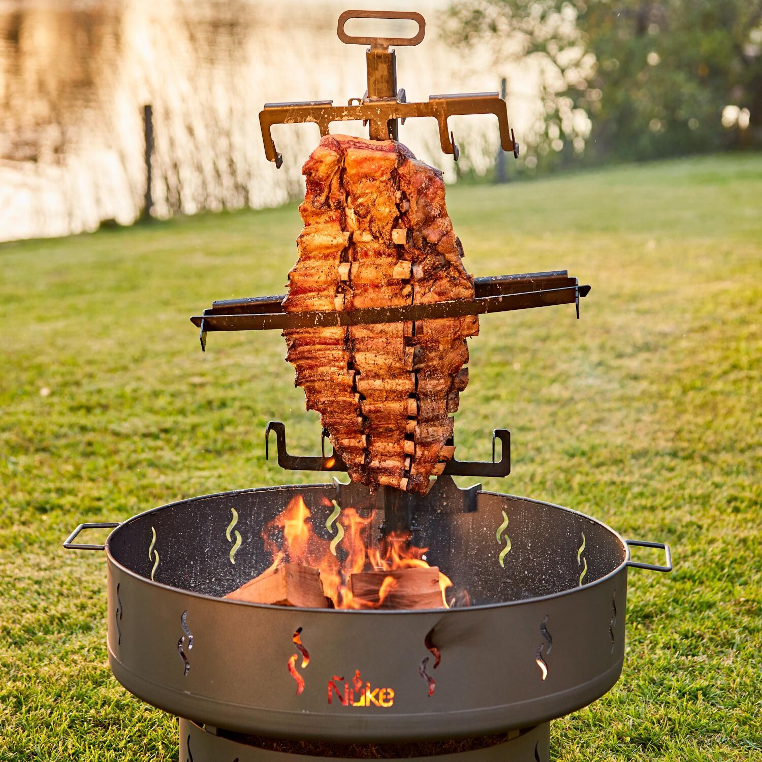 Nuke PATAGONIA Patagonia Wood Firepit and Grill - Ribs Hanging Over Open Fire thumbnail