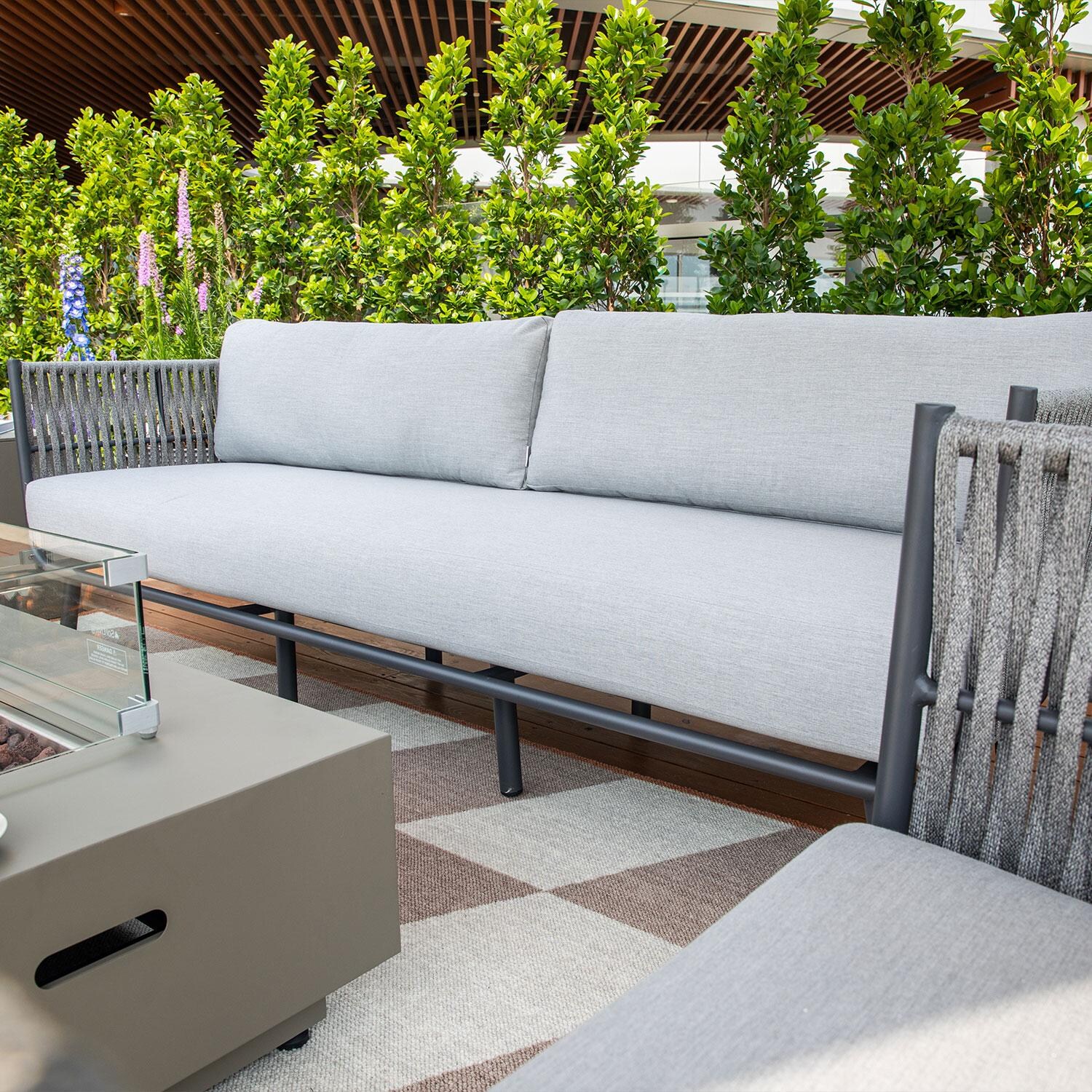 Elementi OS-2504T Milano Outdoor Aluminum Sofa w/ Sunbrella Cushions - Angled View - Lifestyle thumbnail