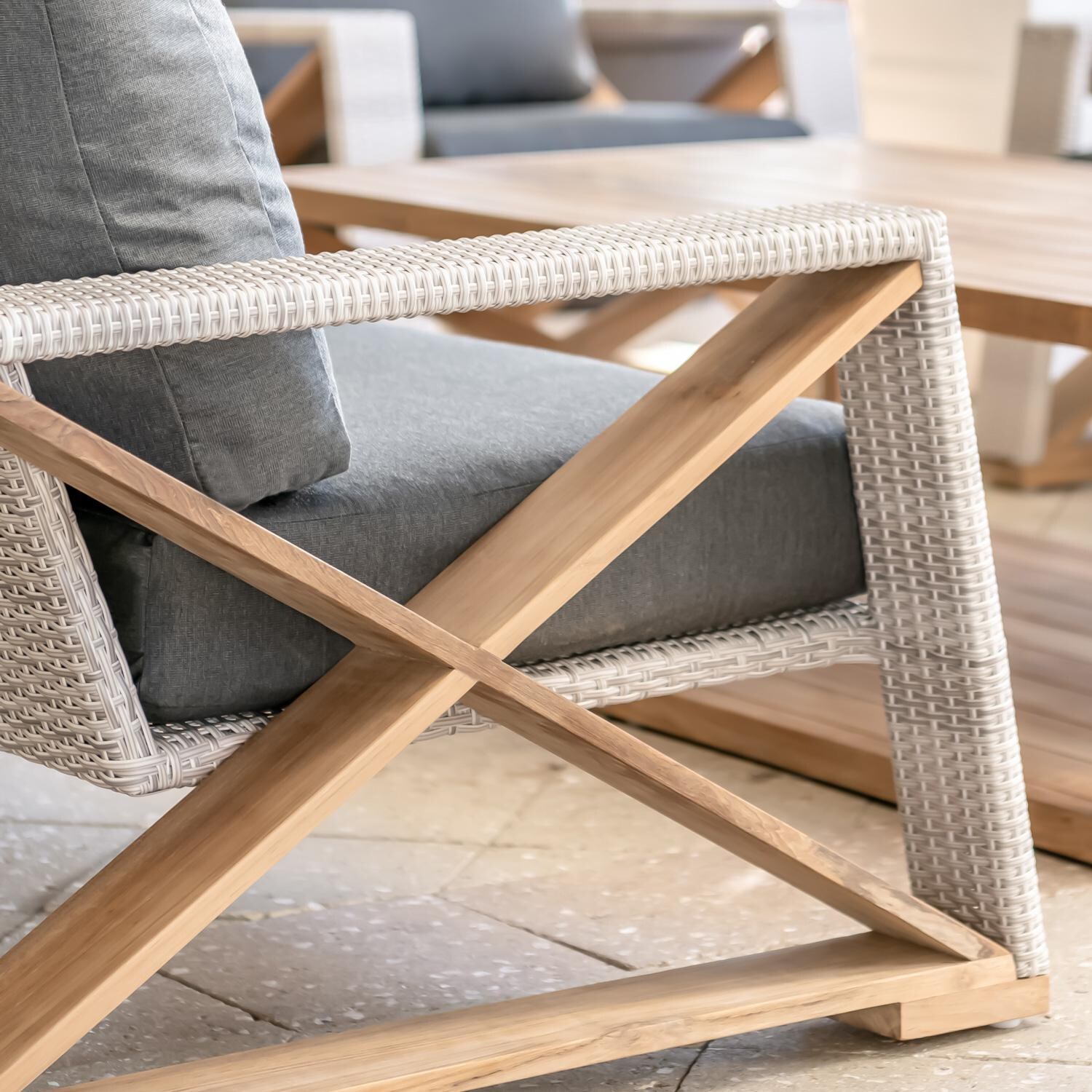 Teak + Table Caicos Loveseat in Granite - Side Detail (Carbon Cushions Shown) - Lifestyle thumbnail
