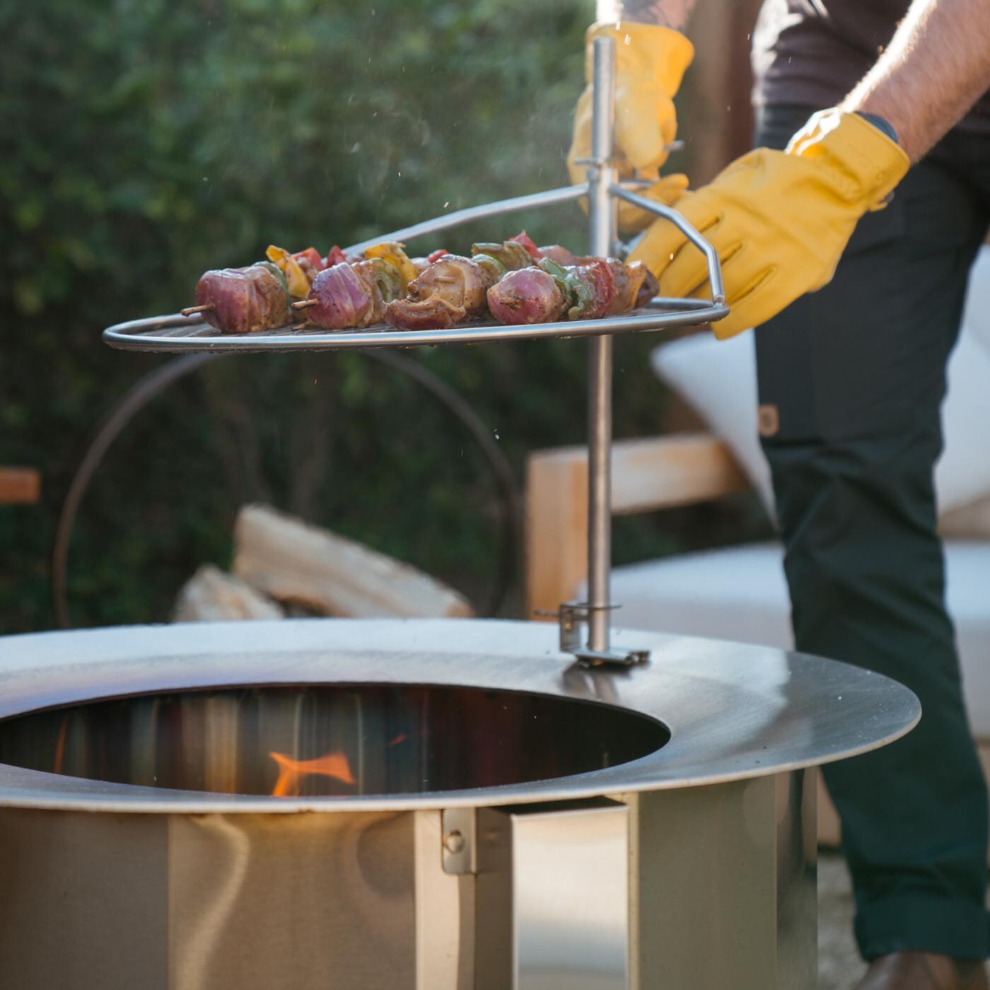 Firegear LUME-MS2SR LUME 26-Inch Round Wood Burning Sear Top Freestanding Smoke-Less Fire Pit - Cooking Lifestyle ** Shown W/ Optional Grill Grate & Rod thumbnail