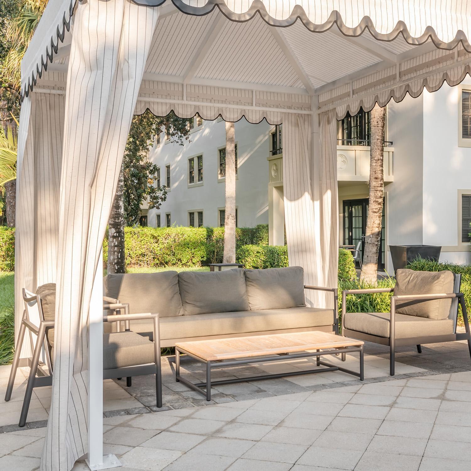 Teak + Table Paros Club Chair in Sand - Patio - Lifestyle thumbnail