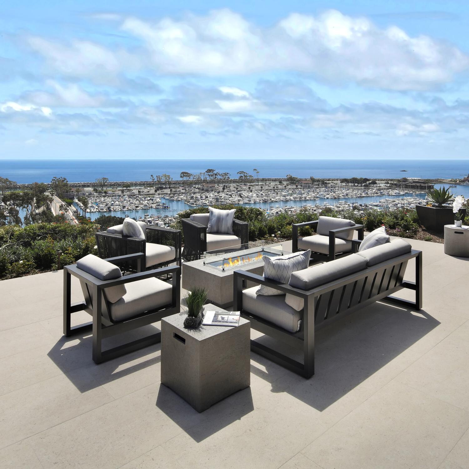 Gravelstone 60-Inch Rectangular Natural Gas Fire Table with Glass Surround by Sunset West - Lifestyle thumbnail