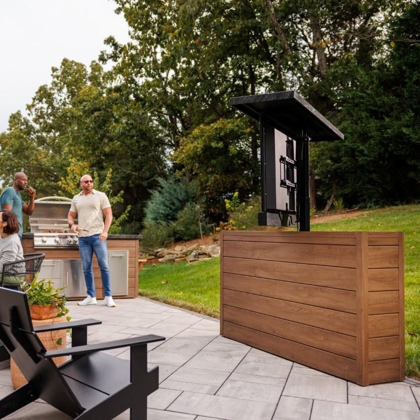 BBQGuys Signature 72 Inch 360 Degree Swivel Outdoor TV Lift Cabinet | Toffee w/ Black Granite - Angled Screen - Lifestyle thumbnail