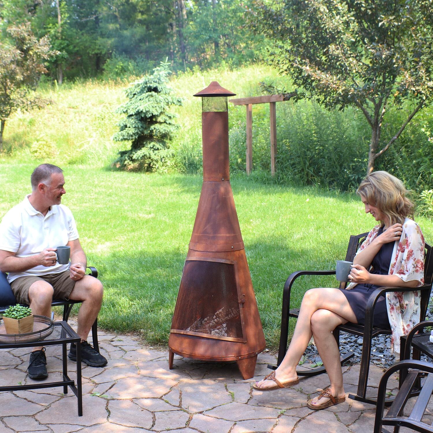 Ultimate Patio 70-Inch Rustic Steel Wood Burning Chiminea - Rust - In Use with Family - Lifestyle thumbnail