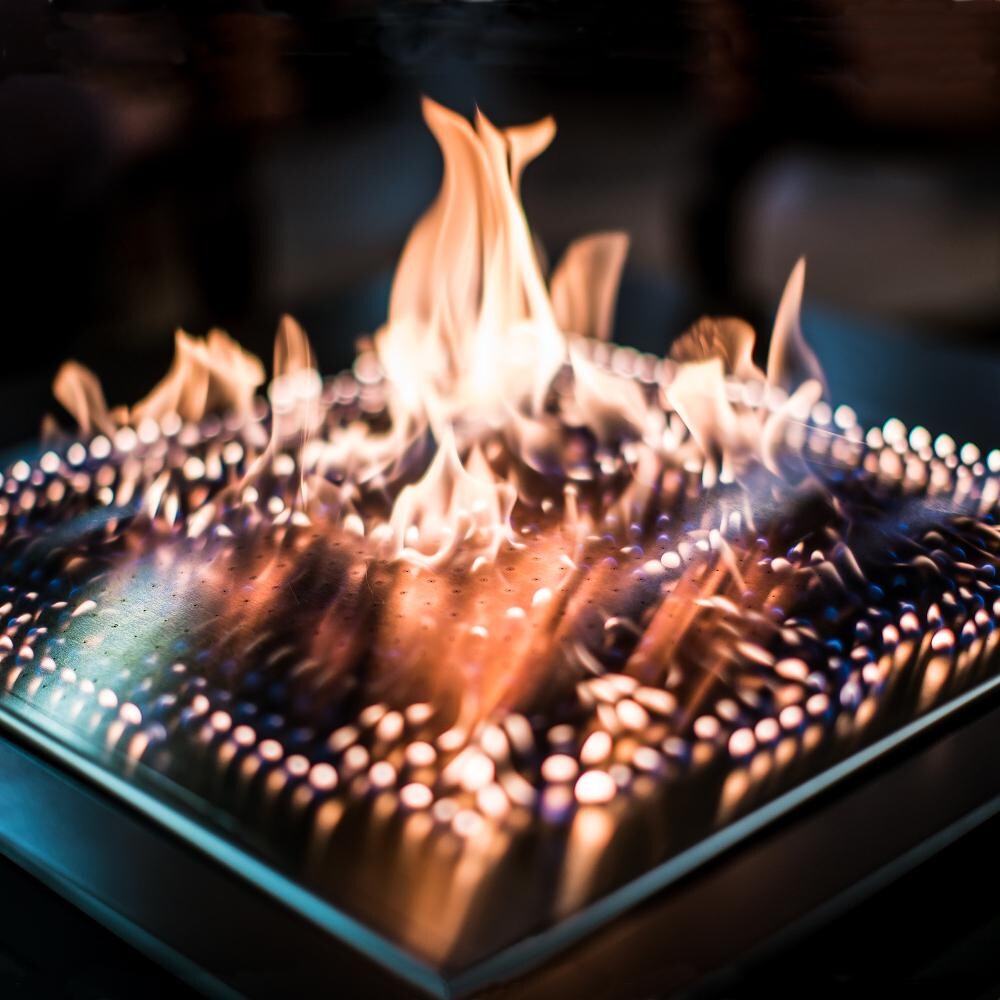 Blazing Beats Laguna Stacked Stone 38 Inch Fire Table - Burner View at Night thumbnail