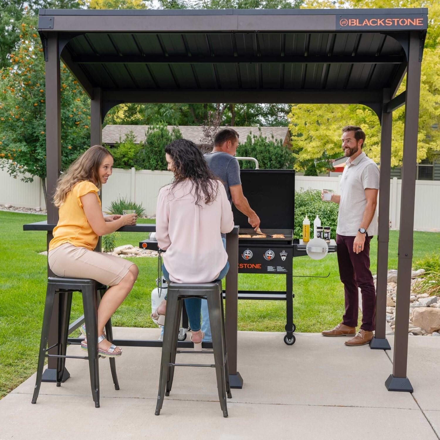 Blackstone 5 x 8-Foot Outdoor Pavilion - Friends Gathered Under Pavilion Grilling - Front View - Lifestyle thumbnail