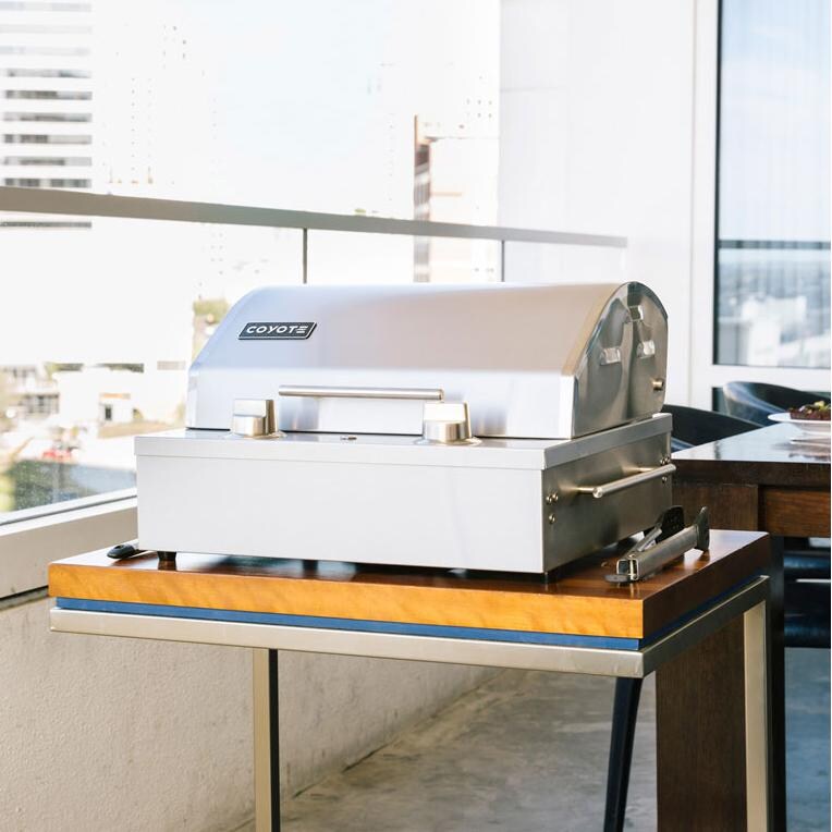 Coyote 18-Inch Portable Electric Grill - Lifestyle View Showing Tabletop Use thumbnail
