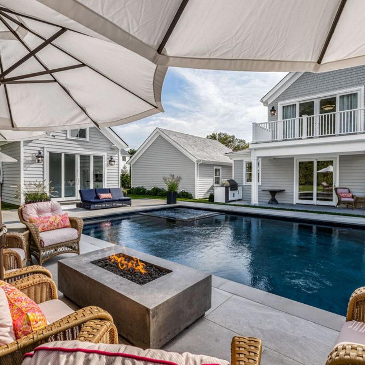 60-in Rectangular Concrete Natural Gas Fire Pit in Limestone by XO Appliance - Backyard Setting - Shown in Gray finish - Lifestyle thumbnail