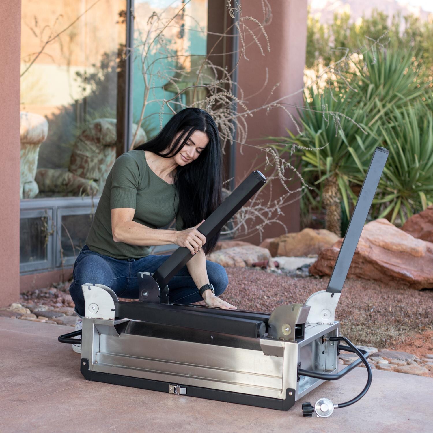 Camp Chef FTG600P 4-Burner Portable Flat Top Grill - Opening Legs - Lifestyle thumbnail