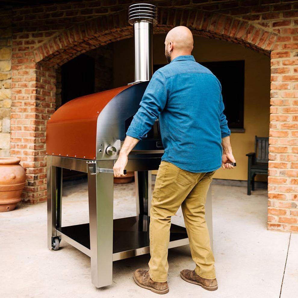 Fontana Forni FTROM-H-R + FTCART-XL Roma Hybrid Pizza Oven on Cart - Red - Using Handles - Lifestyle thumbnail
