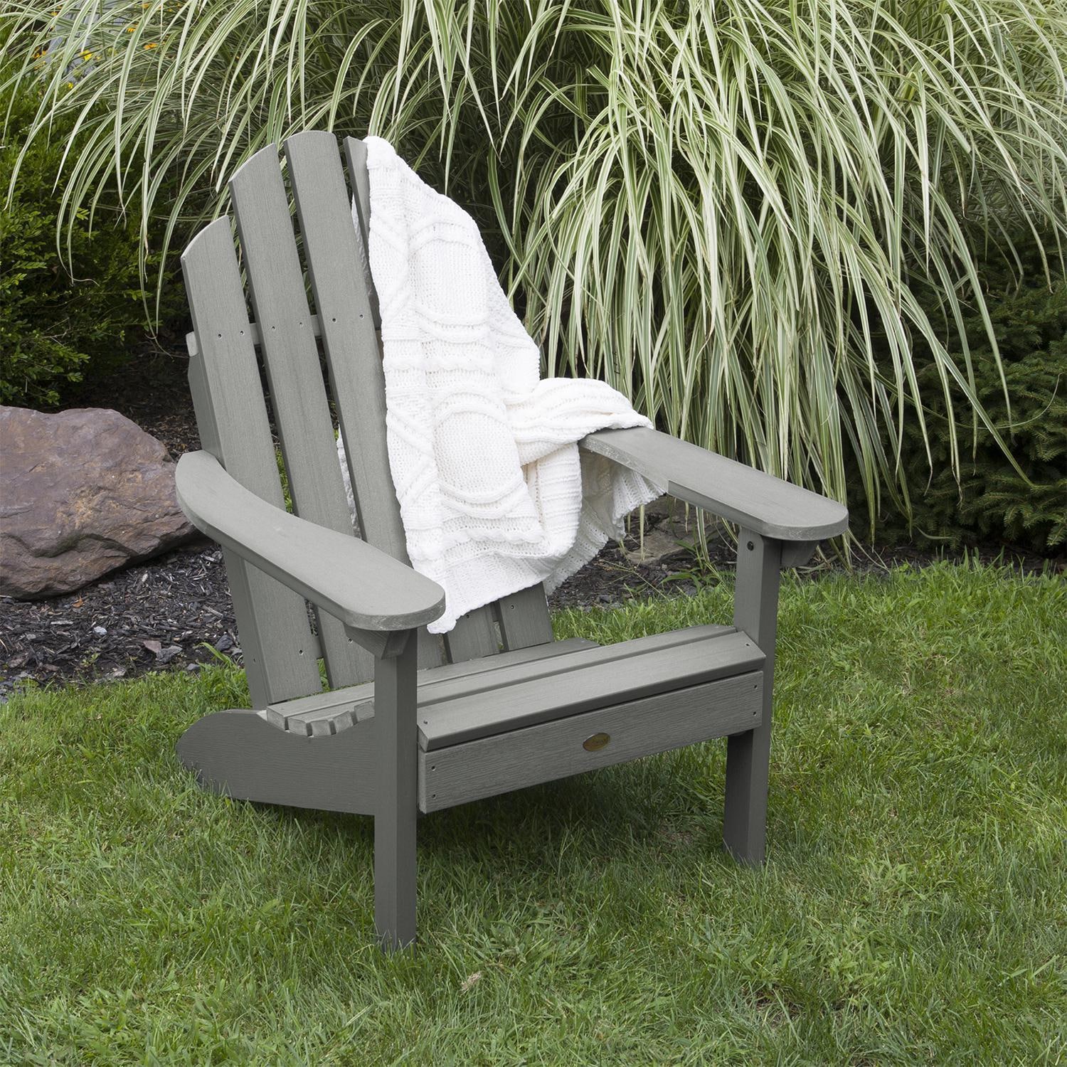Paradise Key Recycled Plastic Adirondack Chair in Coastal Teak by Lakeview Outdoor Designs - Angled View - Lifestyle thumbnail