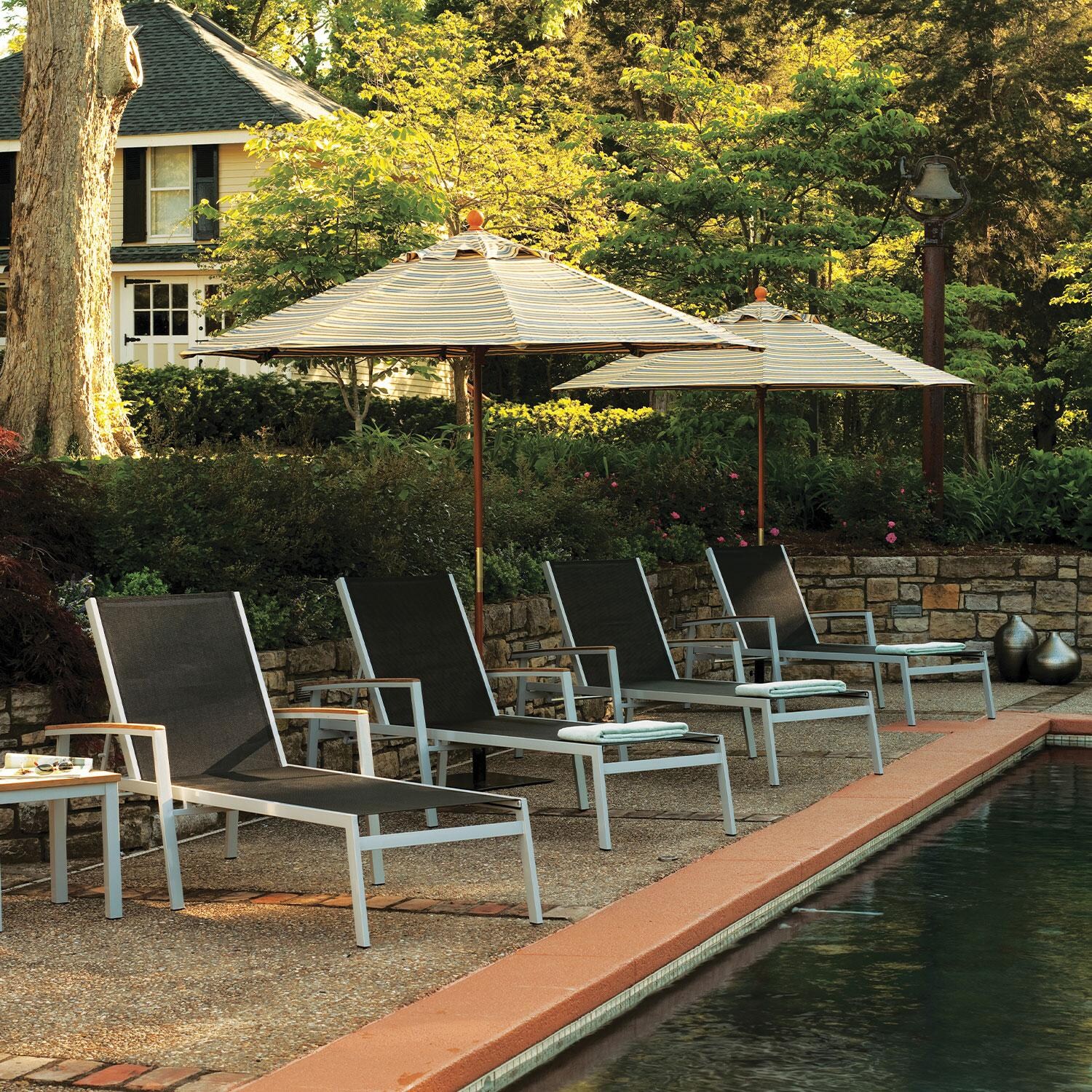 Travira 8 Pc Powder-Coated Aluminum Chaise Lounge Set in Black/Natural/Flint By Oxford Garden - Lifestyle thumbnail
