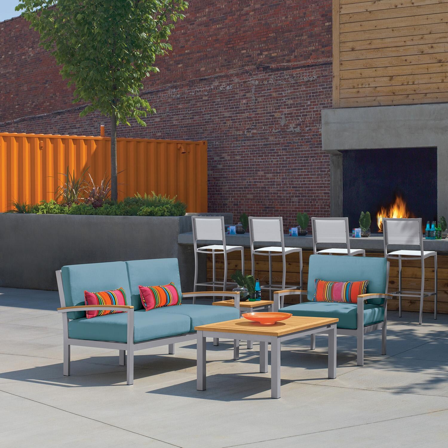 Oxford Garden 5267-PC.F Travira 4 Pc Aluminum Seating Set w/ Club Chair in Natural Tekwood/ Ice Blue by Oxford Garden - On Patio - Lifestyle thumbnail