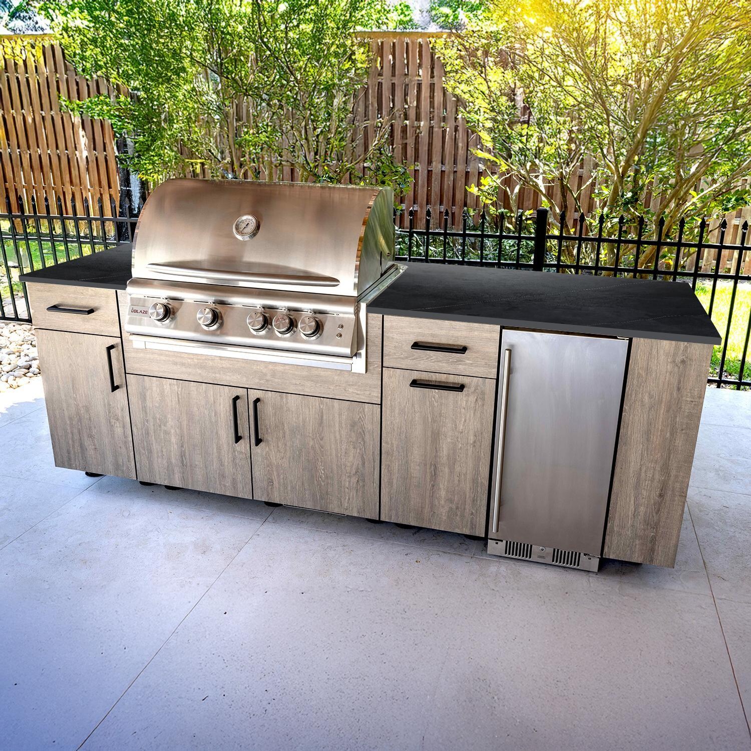 BBQGuys Signature Oasis 8 Ft Outdoor Kitchen Island w/ Blaze Natural Gas Grill & Refrigerator in Riverside Oak/Marquina Black - Island - Lifestyle thumbnail