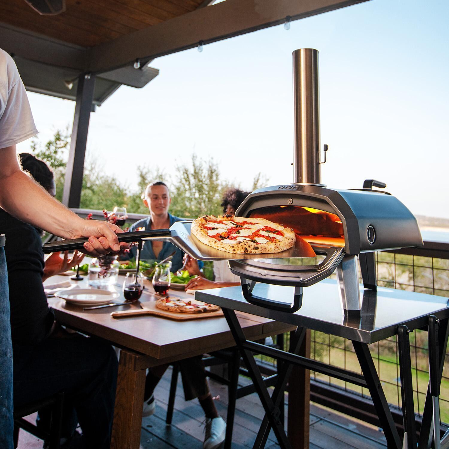 Ooni UU-P25100 Karu 12G Multi-Fuel Portable Pizza Oven - Pizza Party - Lifestyle thumbnail