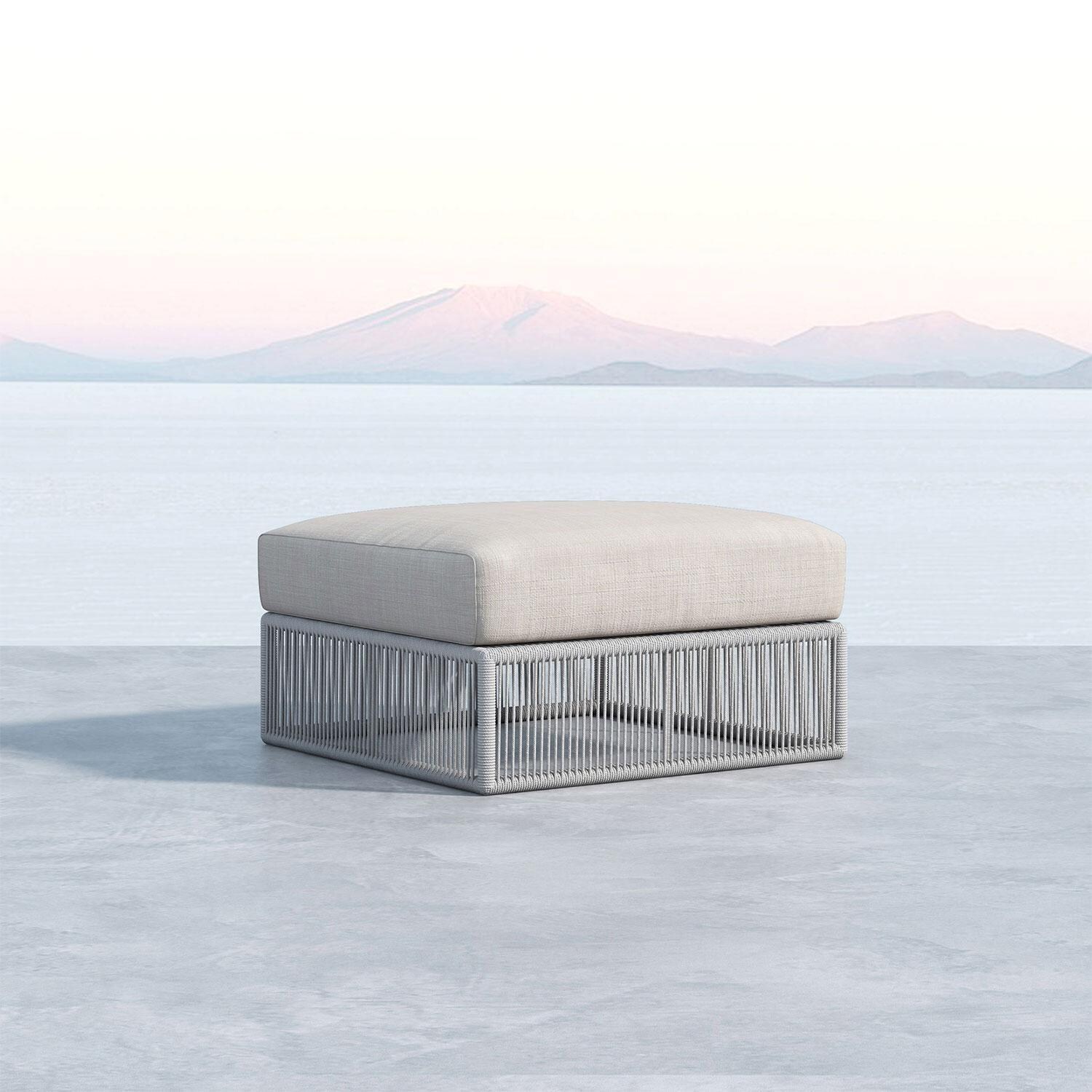 Miami 30 X 23 Rectangular Olfein Rope Patio Ottoman in Dupione Celeste w/ Self Welt by Sunset West - Oceanside View - Shown in Echo Ash finish - Lifestyle thumbnail