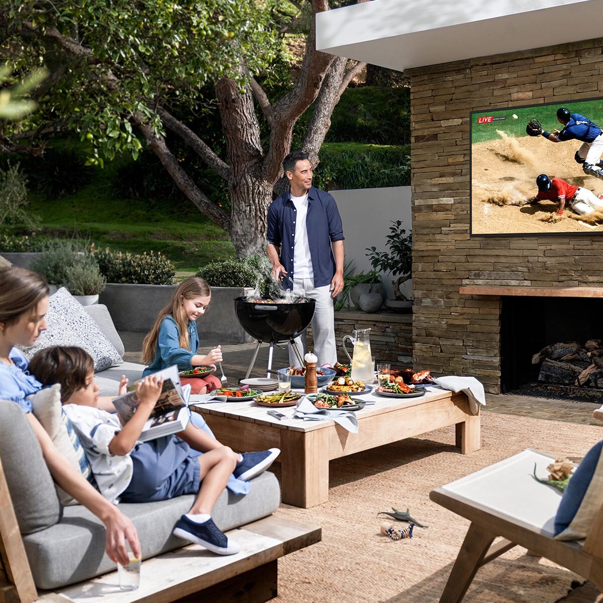 Samsung QN55LST7TAFXZA The Terrace 55 Inch Partial Sun Smart TV - Family Dinner - Lifestyle thumbnail