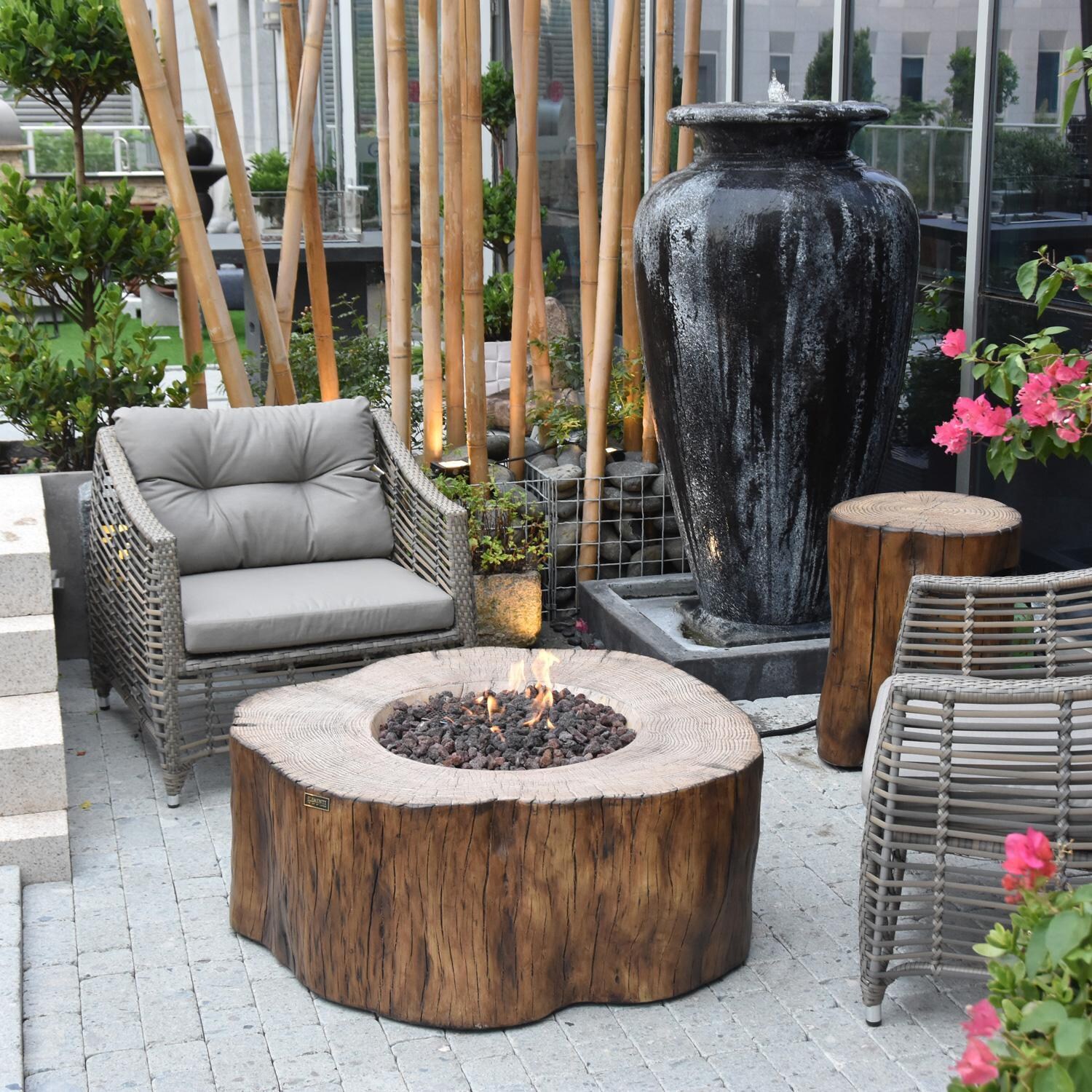 Elementi OFG145RW-LP Manchester 42-Inch Round Propane Fire Pit Table - On Patio - Lifestyle thumbnail