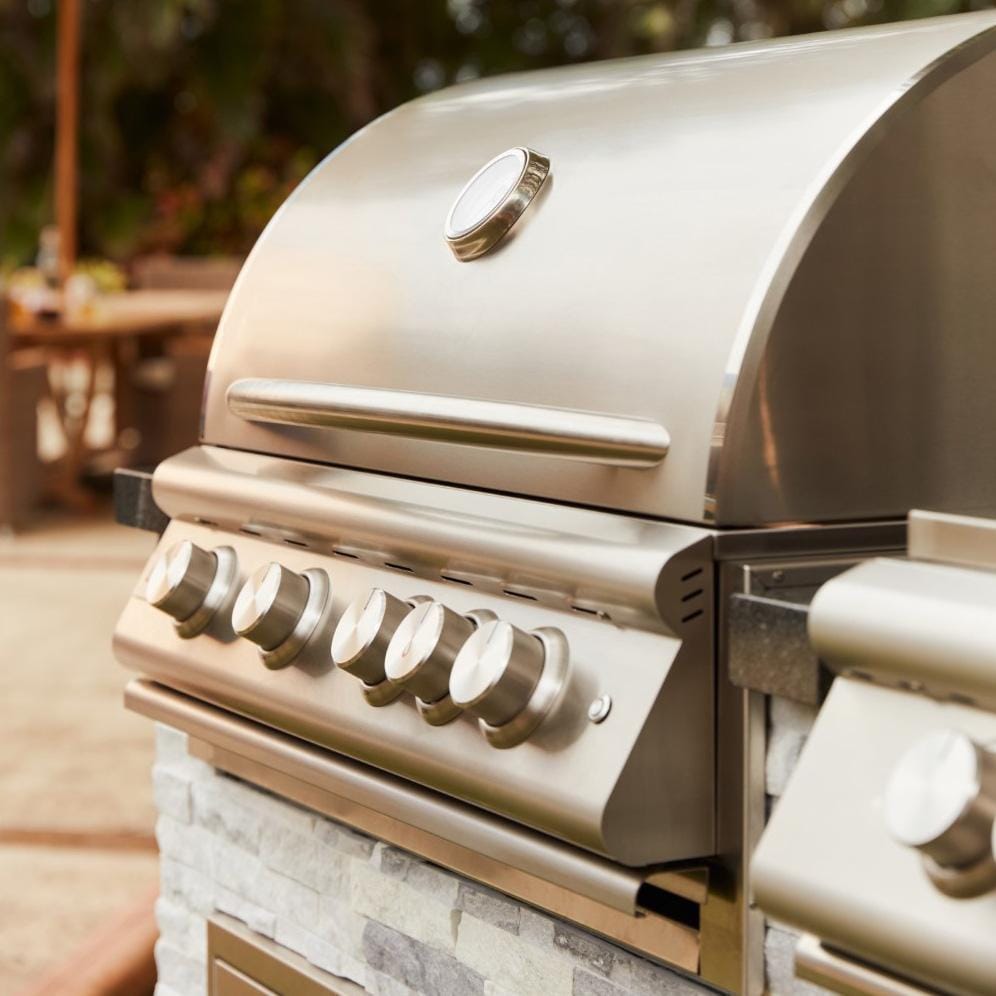 Blaze BLZ-4LTE3-LP Premium LTE+ 32-Inch 4-Burner Built-In Propane Grill With Rear Infrared Burner & Lift-Assist Hood  - Angled View - Lifestyle
