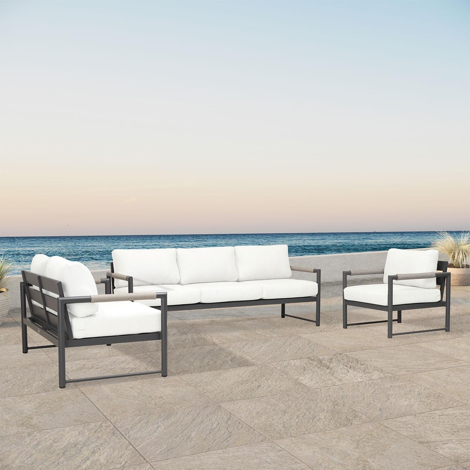 Lakeview AVEBAY-SL-PG-SET143-CN Avenue Bay Slate/Pebble Gray 3 Pc Sofa Loveseat Set - Canvas Natural - Angled On Patio - Lifestyle thumbnail