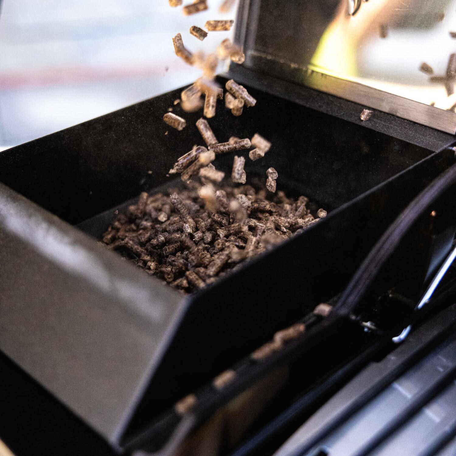 HALO HS-1005-ANA Prime300 Countertop Pellet Grill - Filling the Hopper - Lifestyle thumbnail