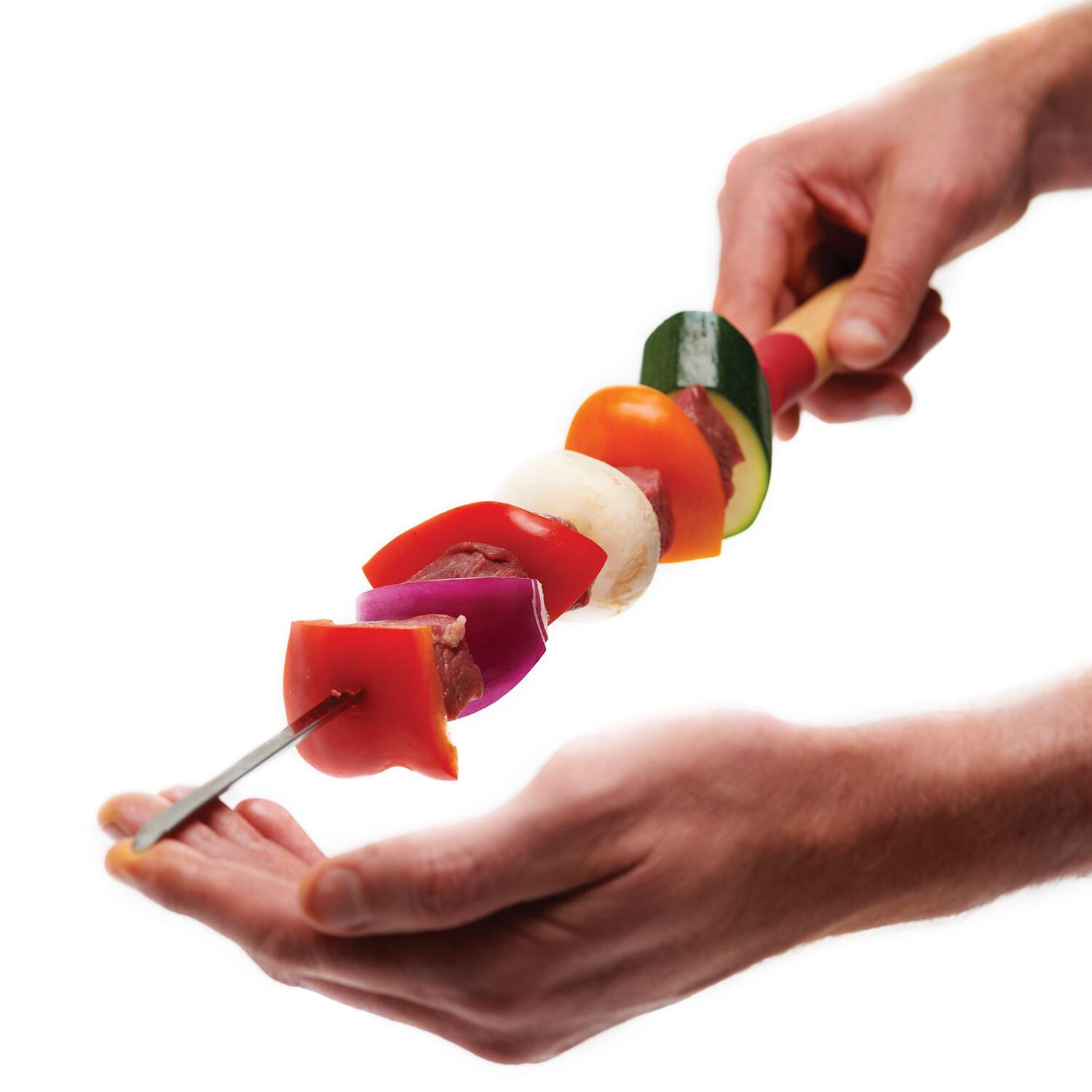 GrillPro 22-in Deluxe Skewers w/ Silicone & Wooden Handles - 40538 - Holding Skewers - White Background thumbnail