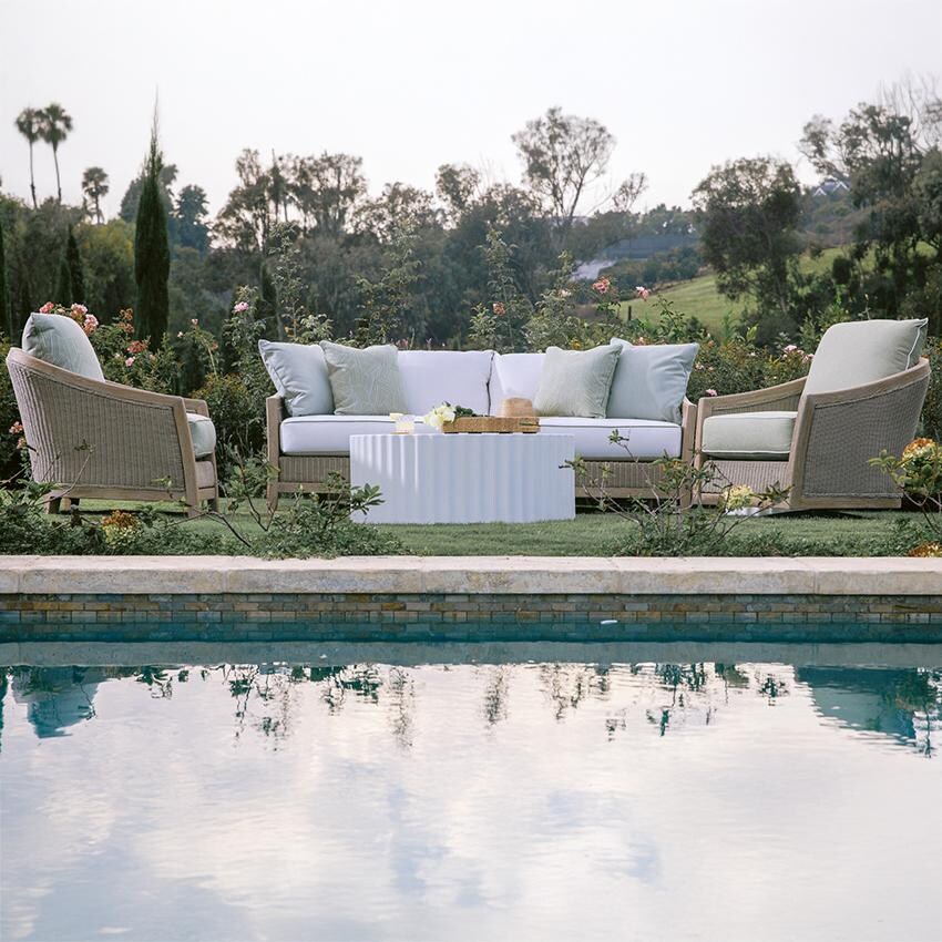 Cambria Teak Sofa in Light Wood/Canvas Canvas by Sunset West - Shown by Pool w/ Companion Pieces (Not Included) - Lifestyle thumbnail