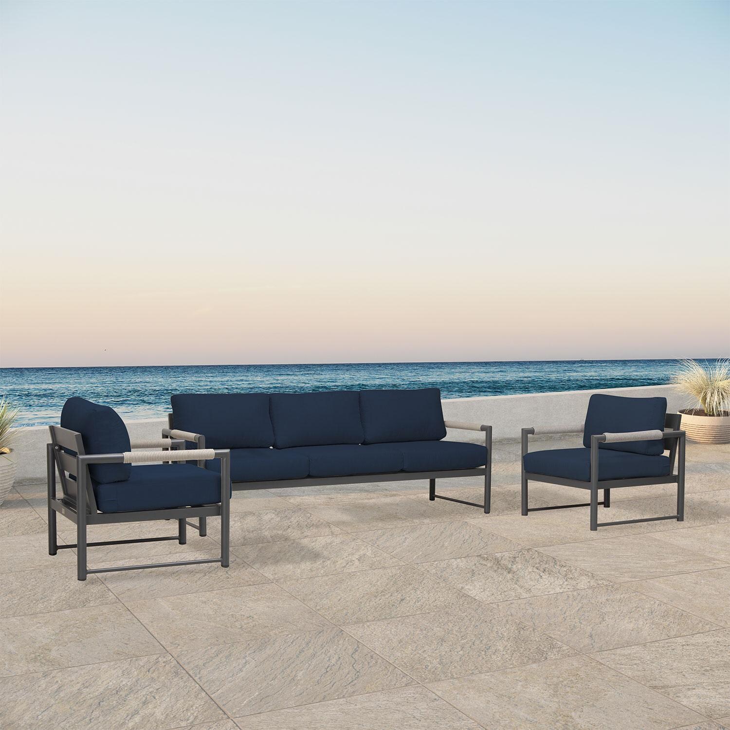 Lakeview AVEBAY-SL-PG-SET141-IN Avenue Bay Slate/Pebble Gray 3 Pc Sofa Club Chair Set - Spectrum Indigo - Angled On Patio - Lifestyle thumbnail