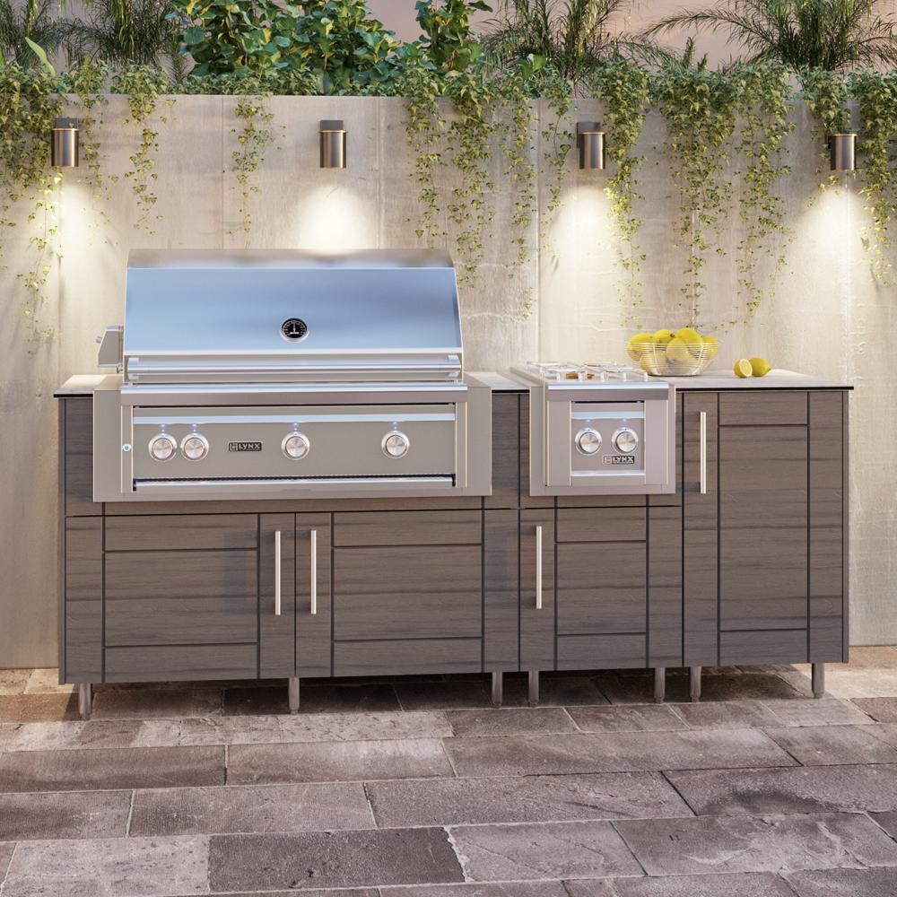 WeatherStrong Abaco 7 Ft Outdoor Kitchen Island w/ Blaze Propane Grill & Side Burner in Dark Ash/Glacier Frost - On Patio - Lifestyle thumbnail