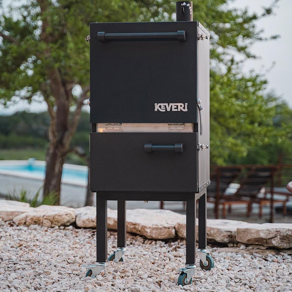 Keveri H1 H1BT Vertical Multi-Purpose Charcoal Oven - Black Truffle - In Front of Pool - Lifestyle thumbnail