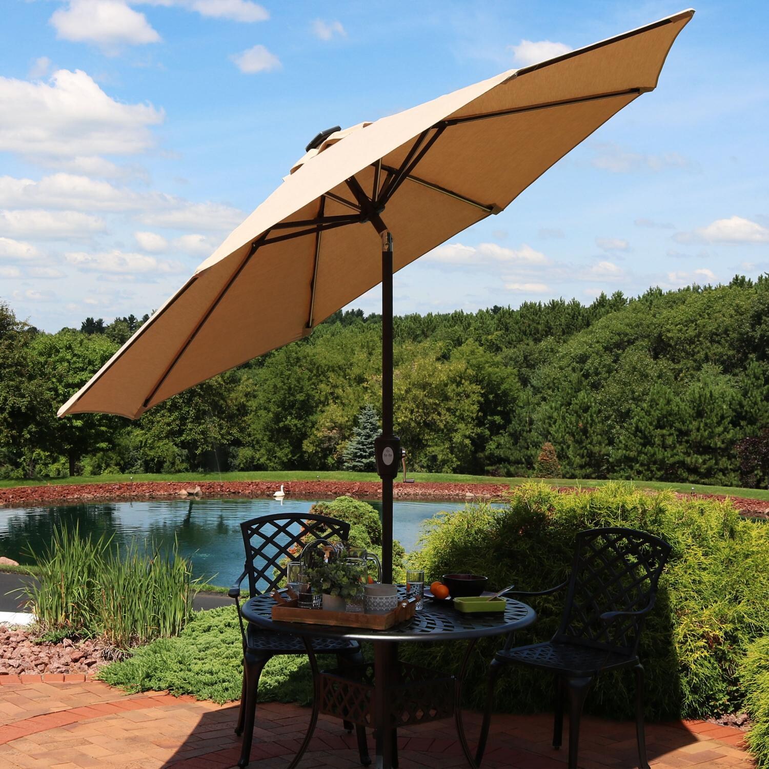 Ultimate Patio 9 Ft. Solar Lighted Patio Umbrella W/ Crank & Tilt - Beige - Tilted Lifestyle View thumbnail