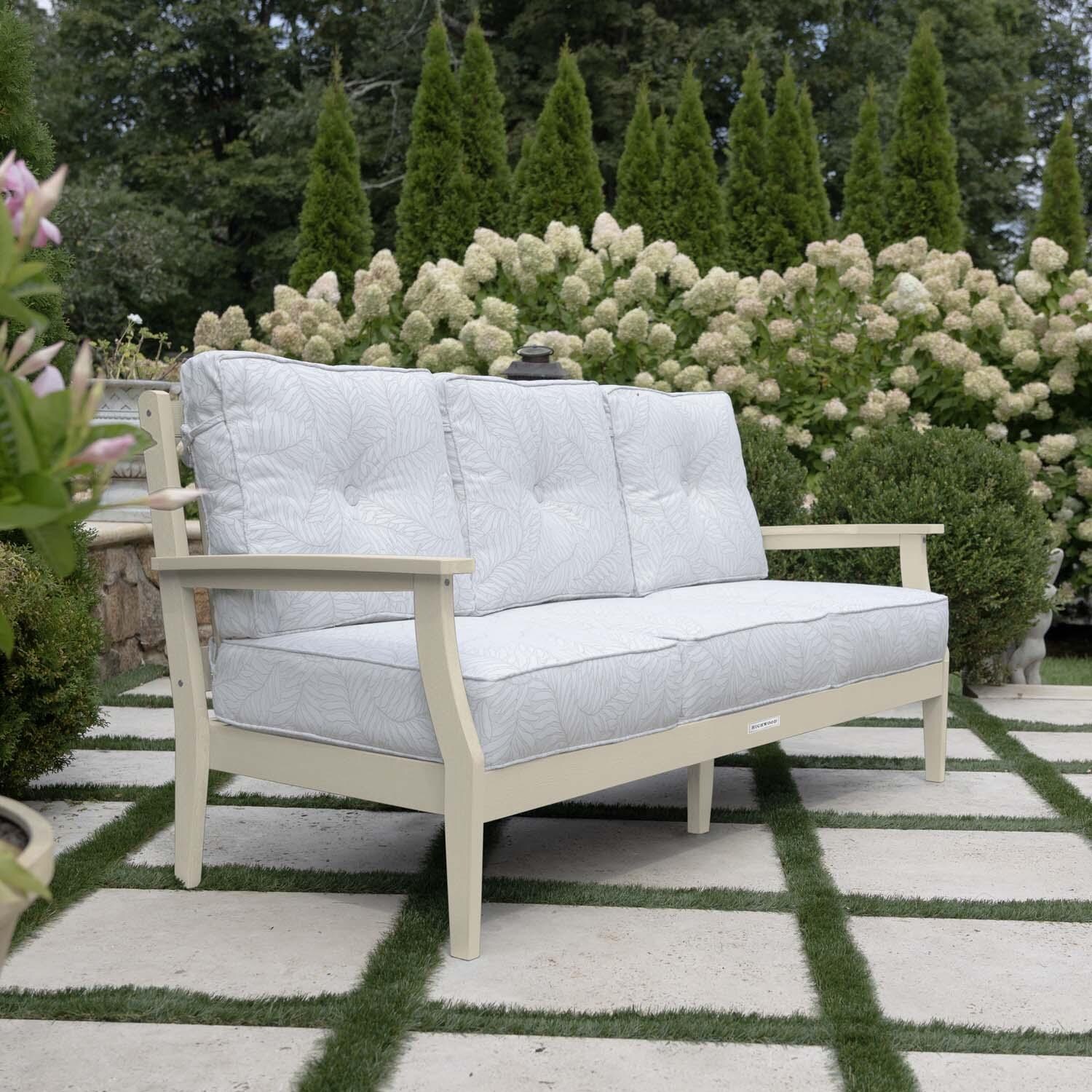 Blushing Bay 3 Person Recycled Plastic Sofa in Lively Parchment/Whitewash by Lakeview Outdoor Designs - Side View - Lifestyle thumbnail