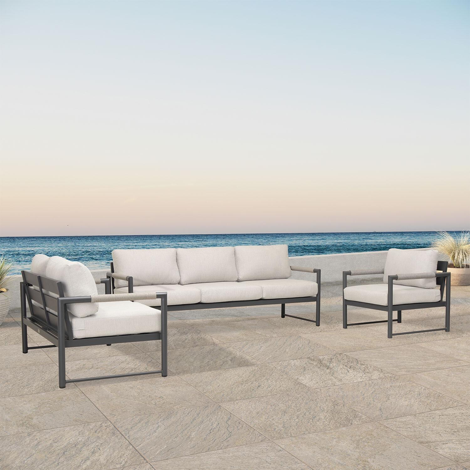 Lakeview AVEBAY-SL-PG-SET143-CS Avenue Bay Slate/Pebble Gray 3 Pc Sofa Loveseat Set - Cast Silver - Angled On Patio - Lifestyle thumbnail