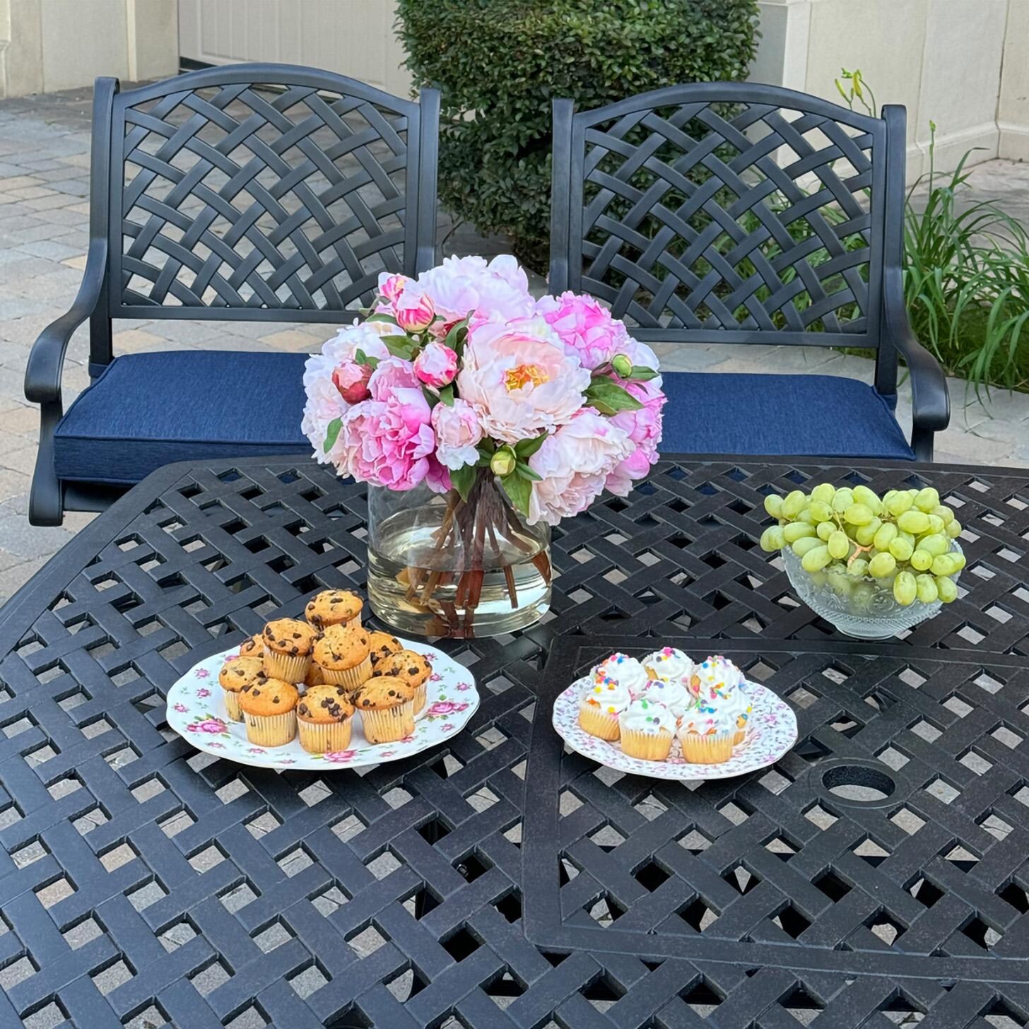 Darlee B/DL13-9PCAR-30W-N Nassau 9 Pc Cast Aluminum Dining Set in Antique Bronze w/ Navy Cushions - Table w/ Flowers - Lifestyle thumbnail