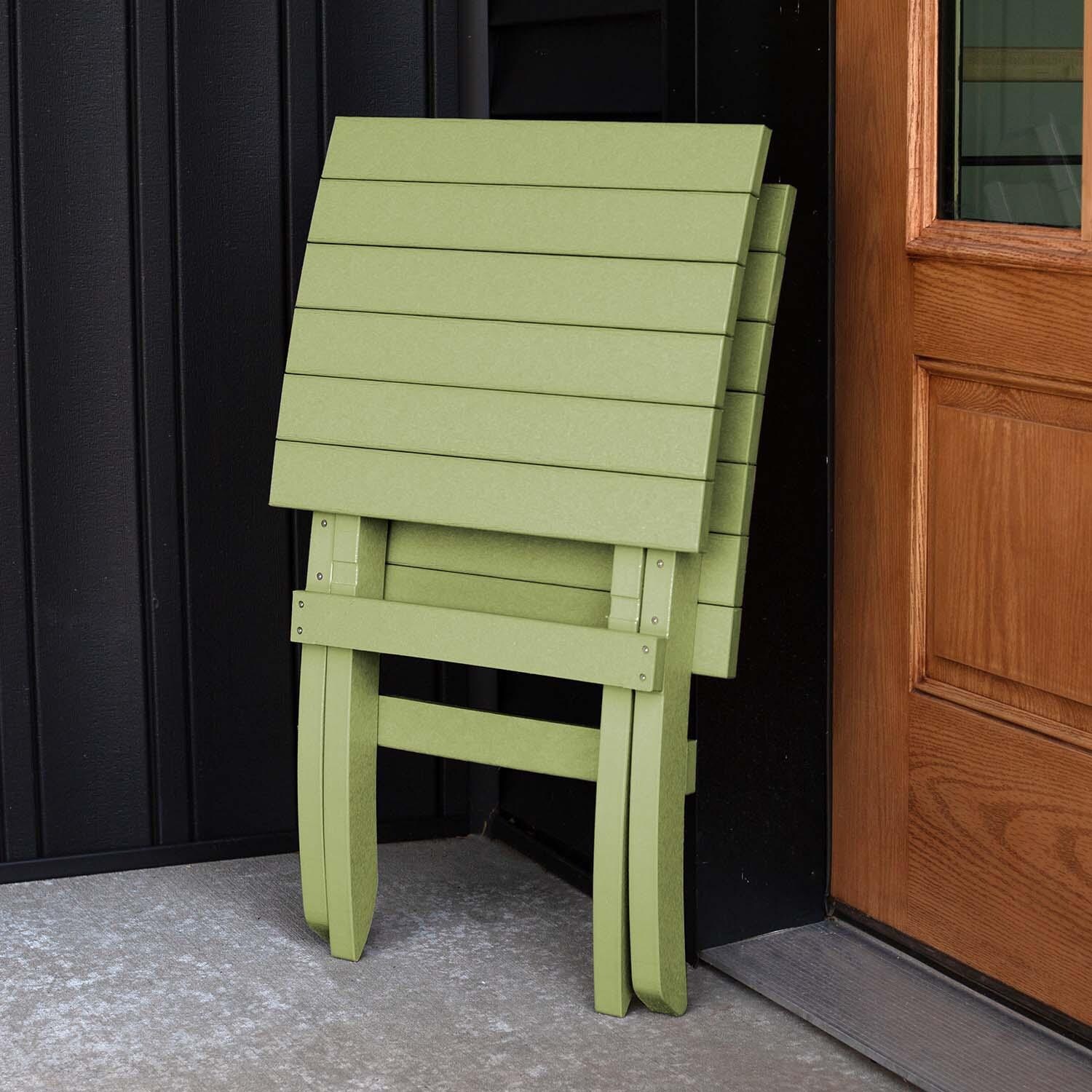 Hazel Cove Recycled Plastic Folding & Stacking Dining Side Chair in Palm Green by Lakeview Outdoor Designs - Folded - Lifestyle thumbnail