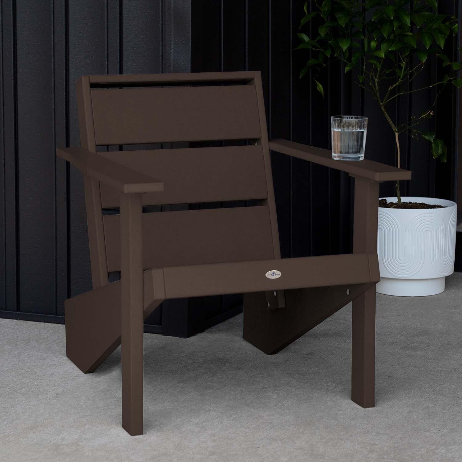 Hazel Cove Recycled Plastic Adirondack Chair in Mangrove Brown by Lakeview Outdoor Designs - Next to Flowerpot - Lifestyle thumbnail