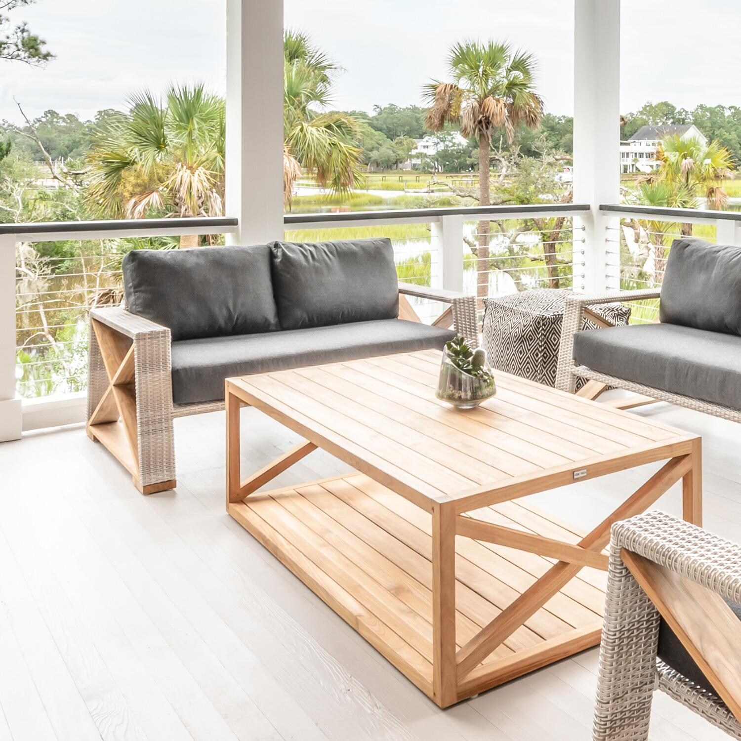 Teak + Table Caicos Loveseat in Granite - Deck Lifestyle View (Carbon Cushions Shown) - Lifestyle thumbnail