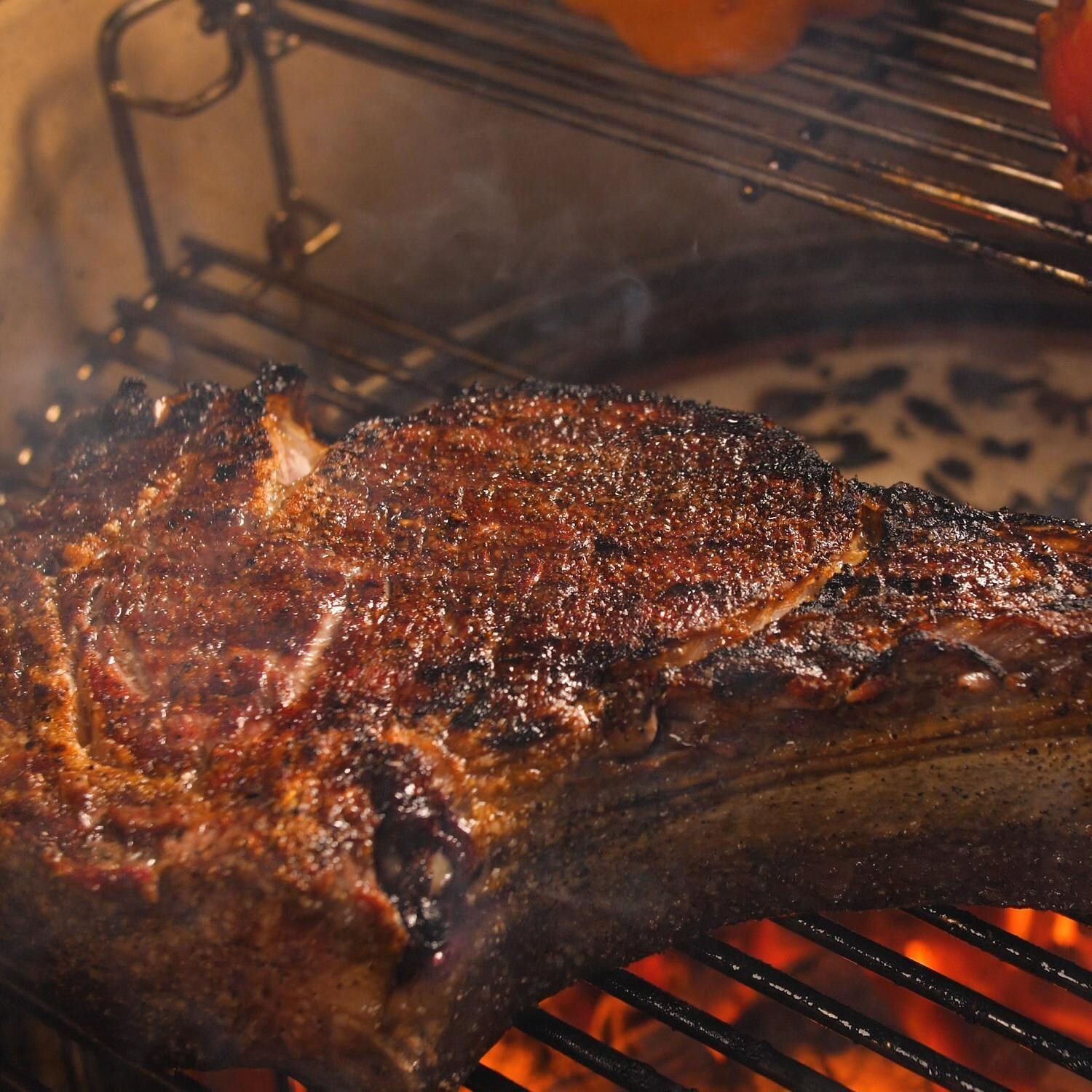 Kamado Joe Big Joe III 24-in Ceramic Kamado Grill Bundle - Searing Steak - Lifestyle