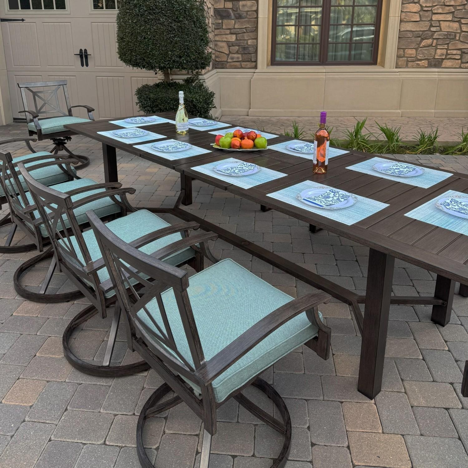 Atlantis 9 Pc Aluminum Dining Set w/ 6 Swivel Rocker Dining Arm Chairs, 2 Two Person Benches & Extension Table in Walnut/Spa by Darlee - Angled - Lifestyle thumbnail