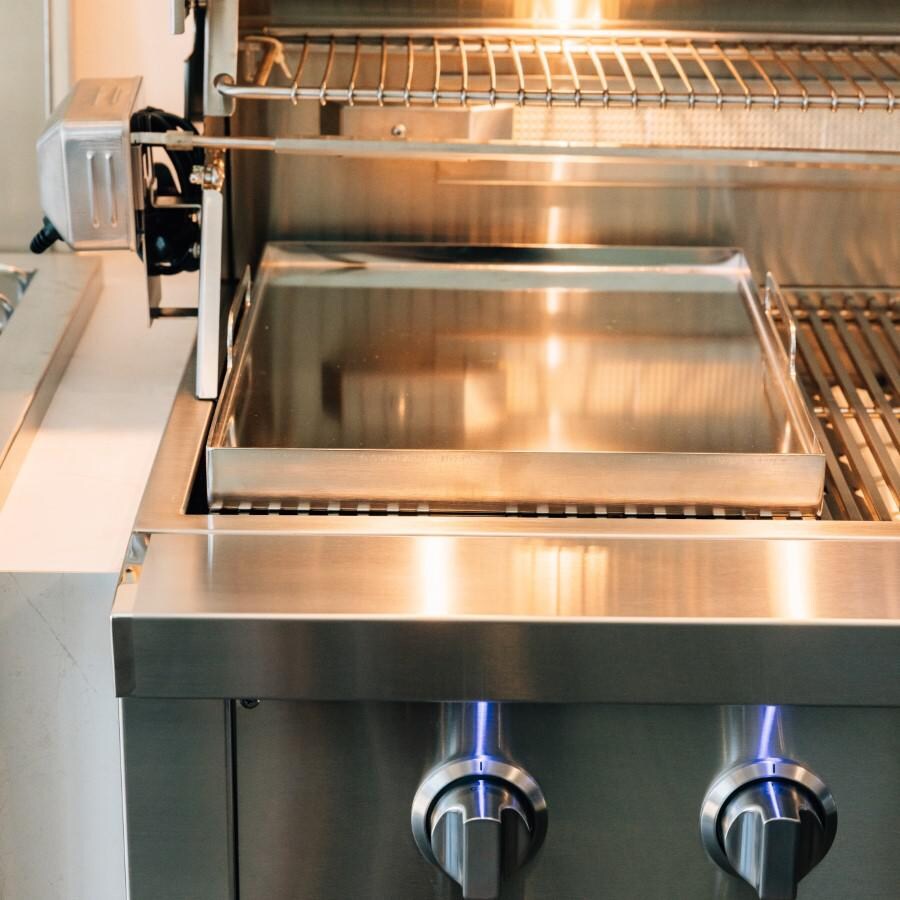 American Made Grills AMG-GP-18 14.5 x 18 Inch Griddle Plate - Front View on Grill with Light Shining on it thumbnail