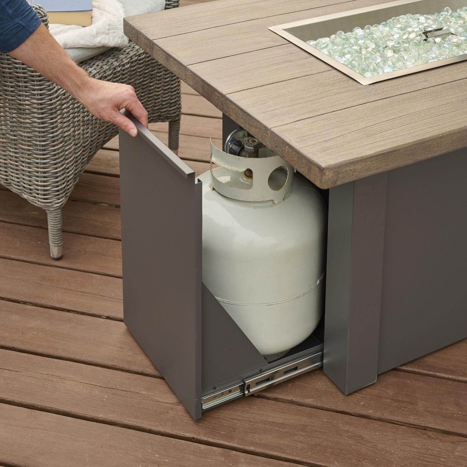 Havenwood 44 Inch Fire Pit Table W/ Driftwood Top & Grey Base - Hand Reaching For Tank Drawer - Lifestyle thumbnail