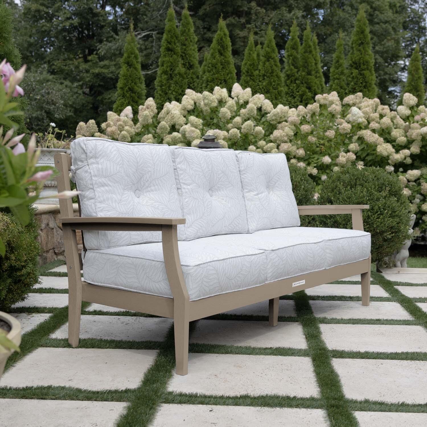 Blushing Bay 3 Person Recycled Plastic Sofa in Lively Parchment/Woodland Brown by Lakeview Outdoor Designs - Side View - Lifestyle thumbnail