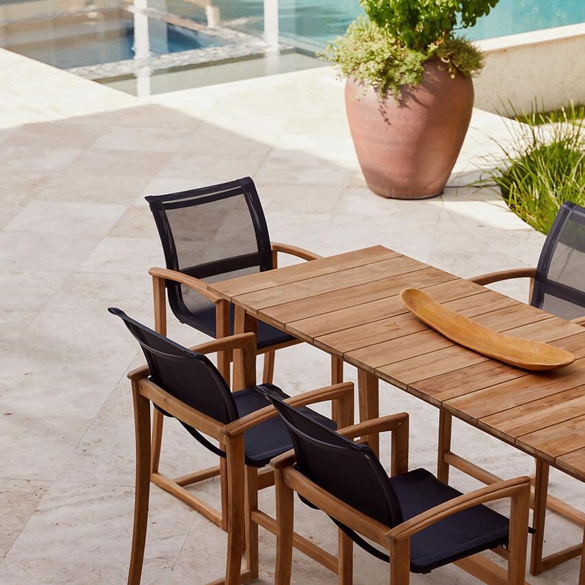 Teak + Table Capri Sling Bar Chair in Grey - Outside - Lifestyle thumbnail